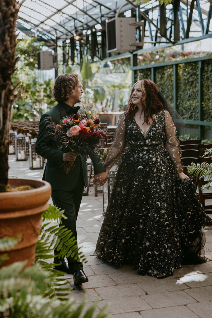 Cute couple holding hands during their portraits