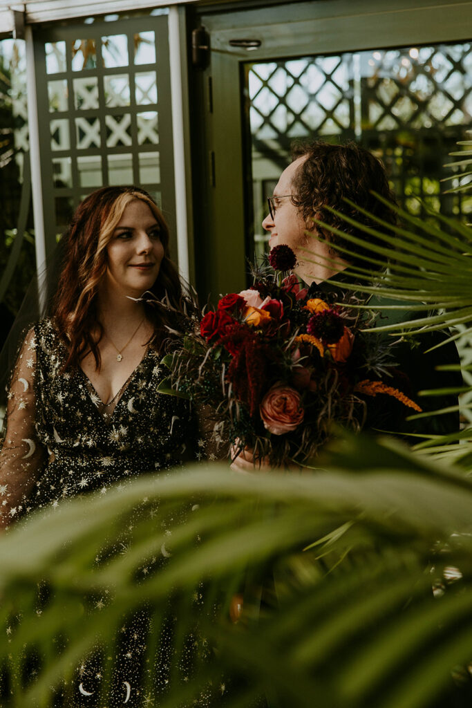 Picture of the bride and groom, smiling at each other