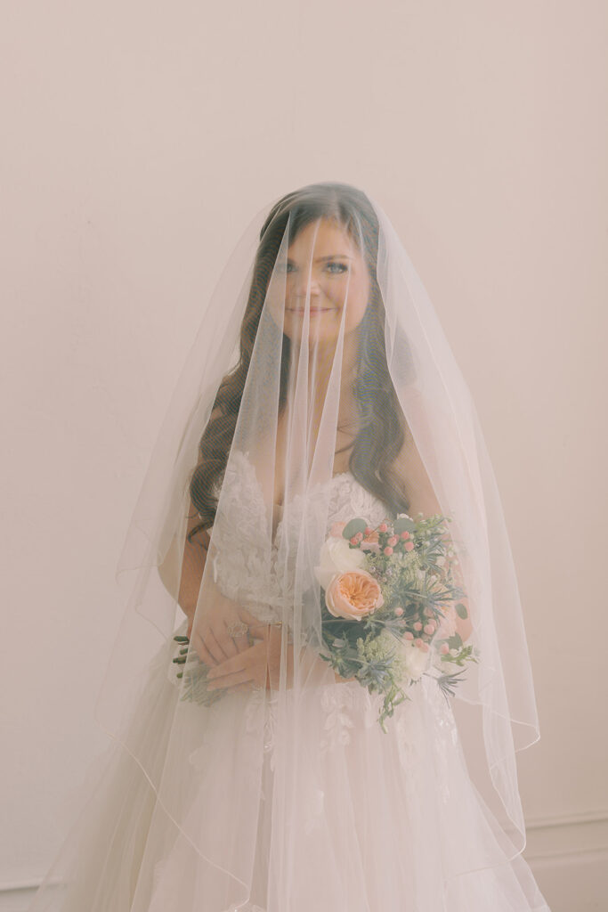 bride smiling at the camera during her photoshoot