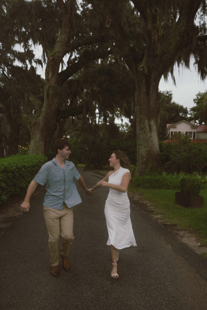 Couple playing during their engagement photos