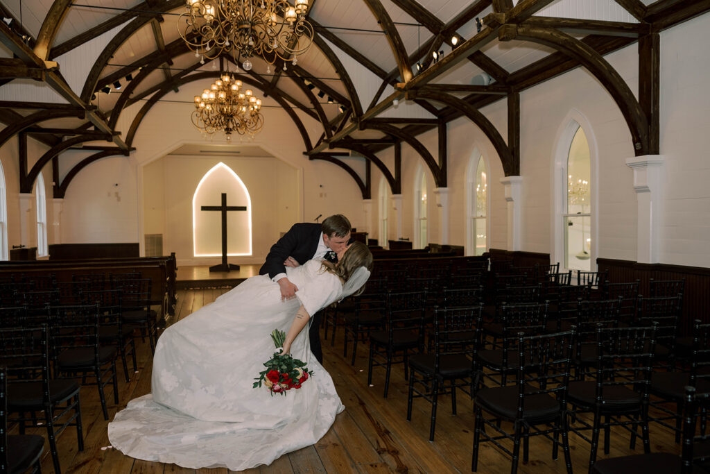 stunning picture of the newlyweds kissing after their ceremony