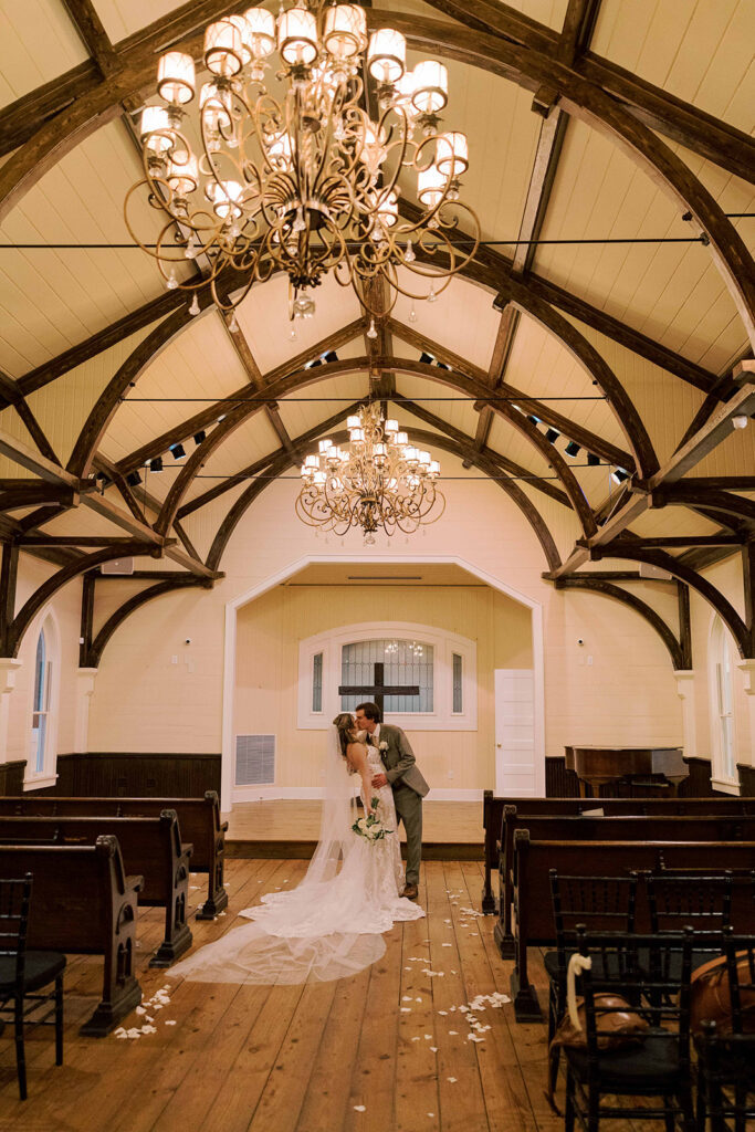 picture of the newlyweds kissing after their ceremony