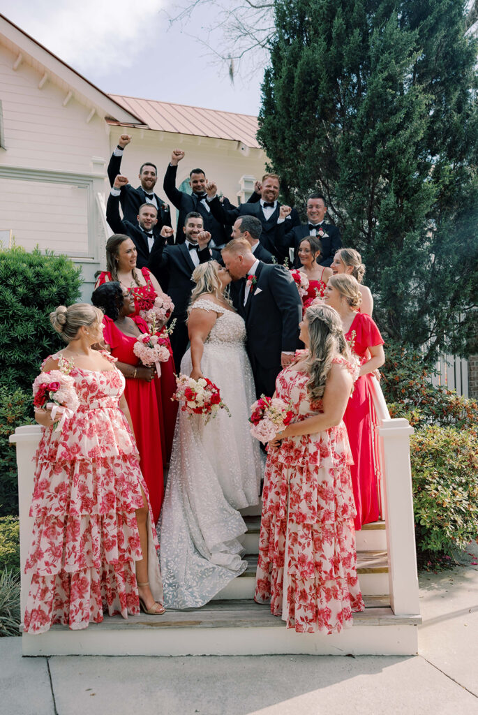 picture of the bride and groom with their bridesmaids and groomsmen
