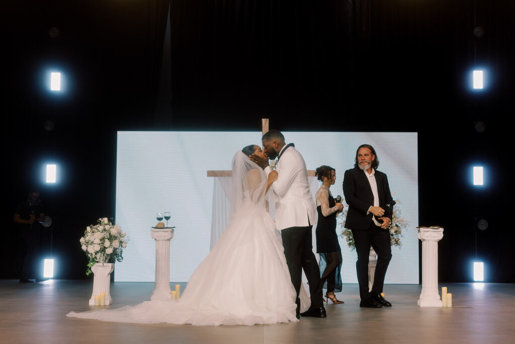 bride and groom kissing after their ceremony
