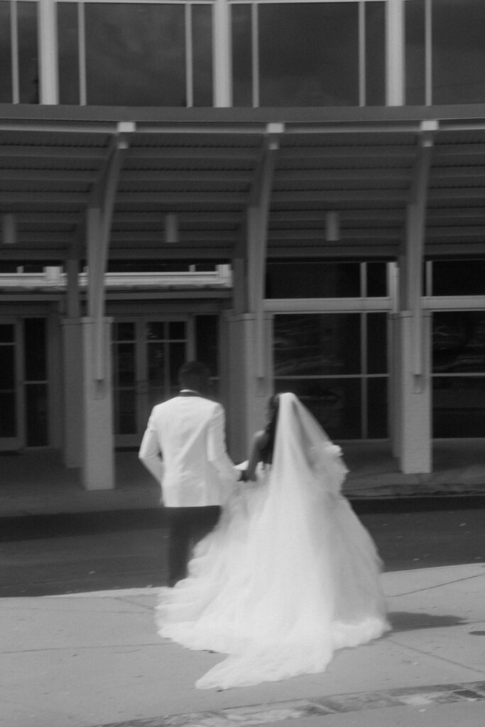 cute portrait of the newlyweds heading to their reception