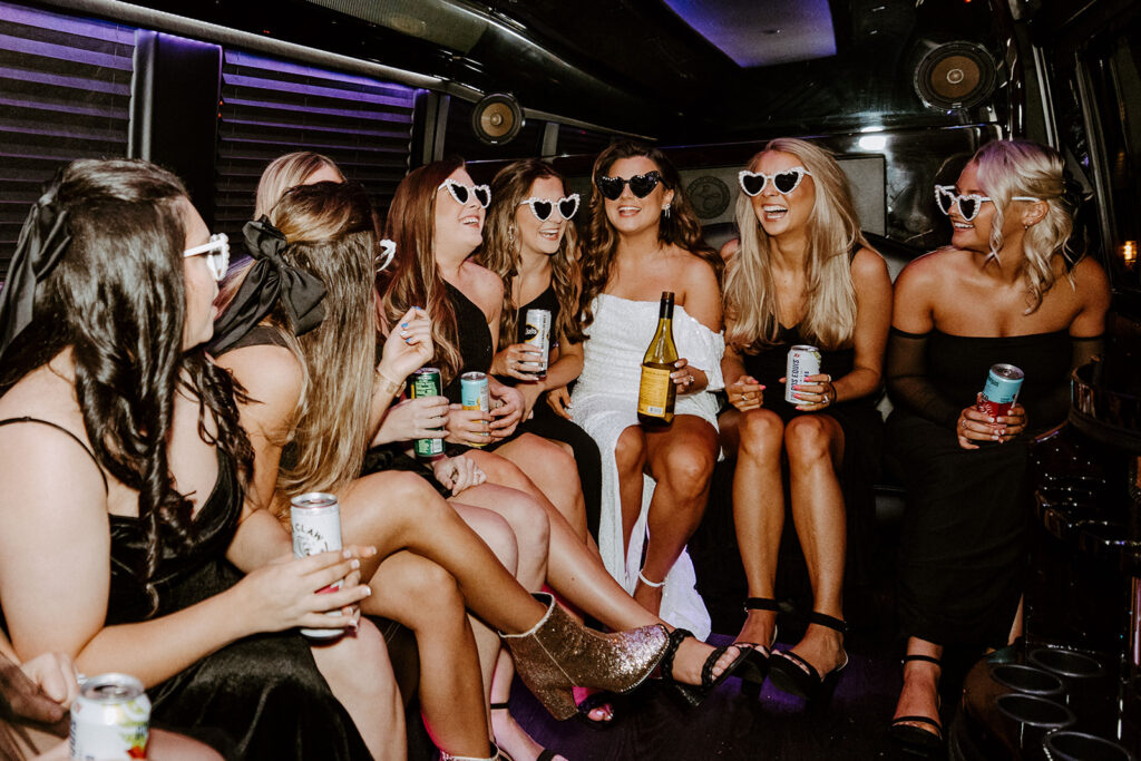 bride and her bridesmaids at a limo party