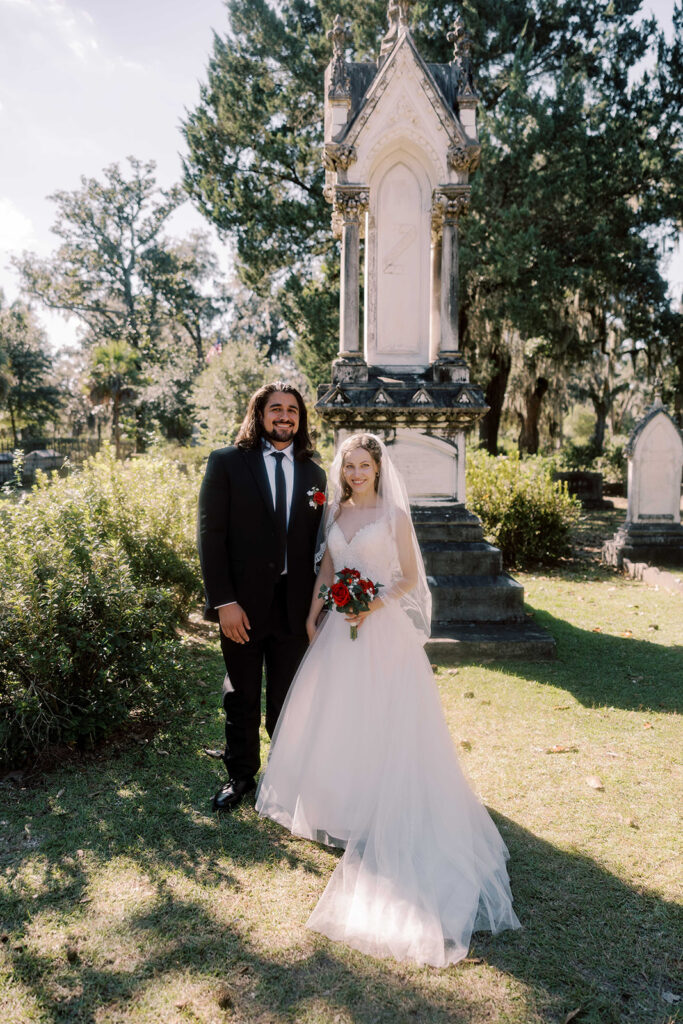 Couple smiling at the camera during their bridal session