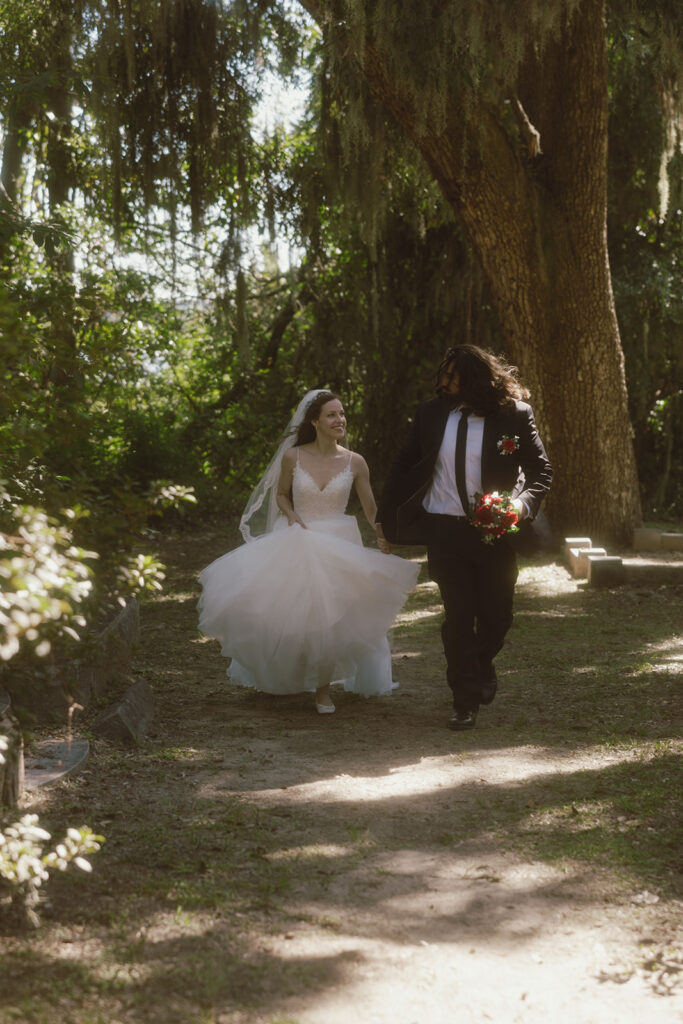 Couple playing with each other during their bridal portraits