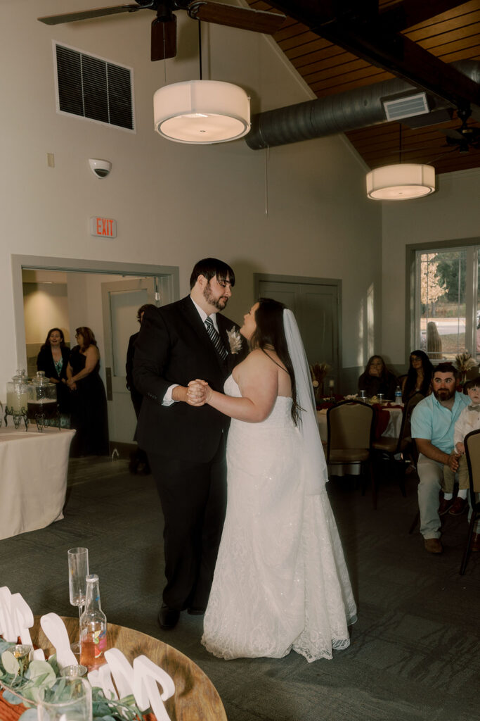 newly married couple at their first dance at their wedding reception