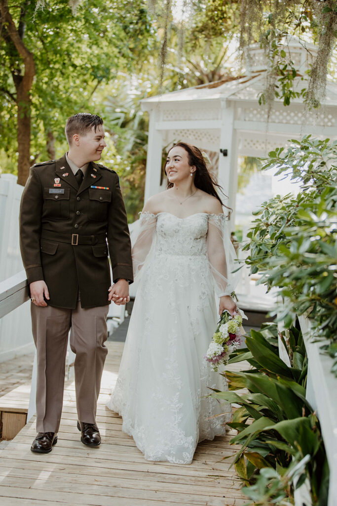 Cute picture of the bride and groom holding hands