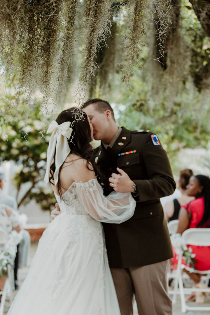 Portrait of the newly married couple kissing