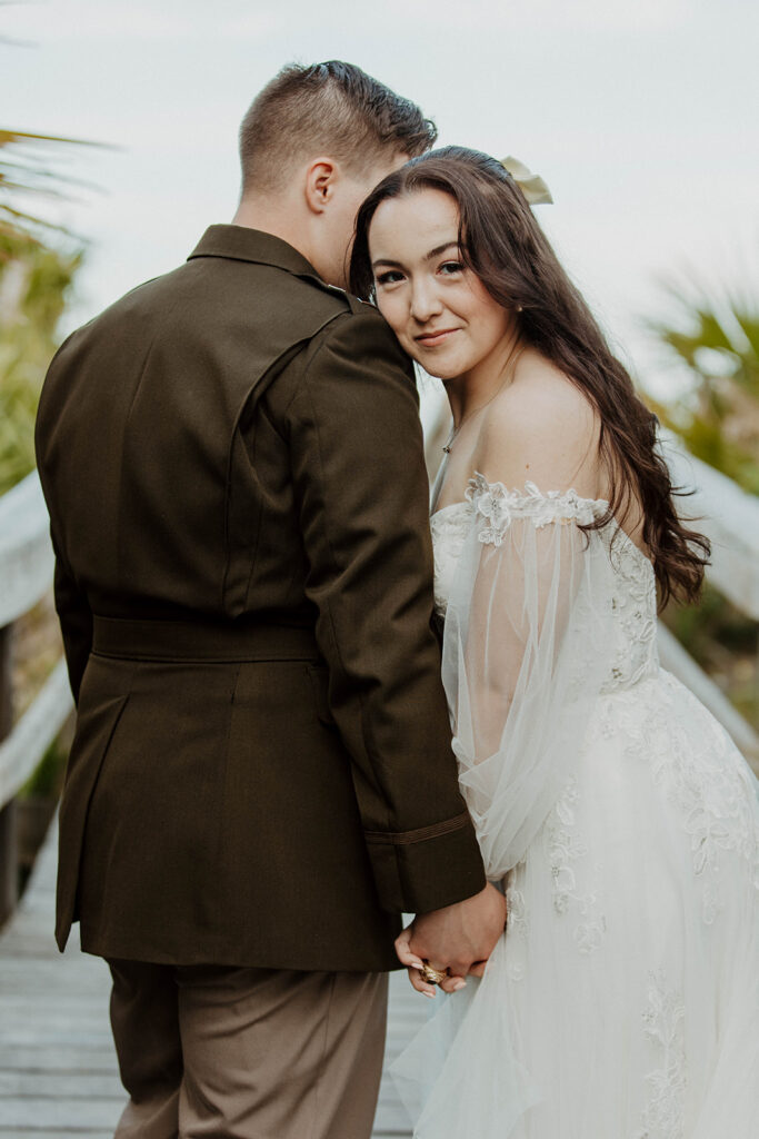 Newly married couple other during bridal session