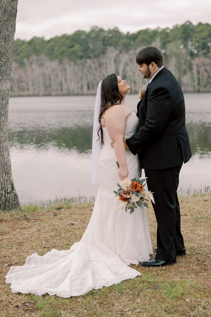 cute picture of the bride and groom smiling at each other