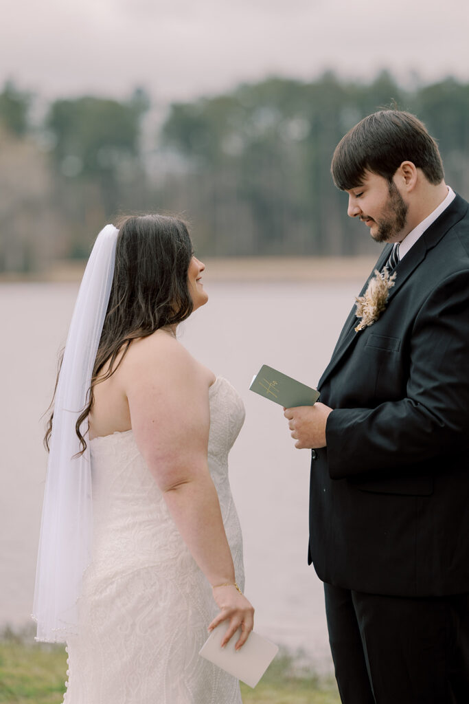 bride and groom reading their private vows
