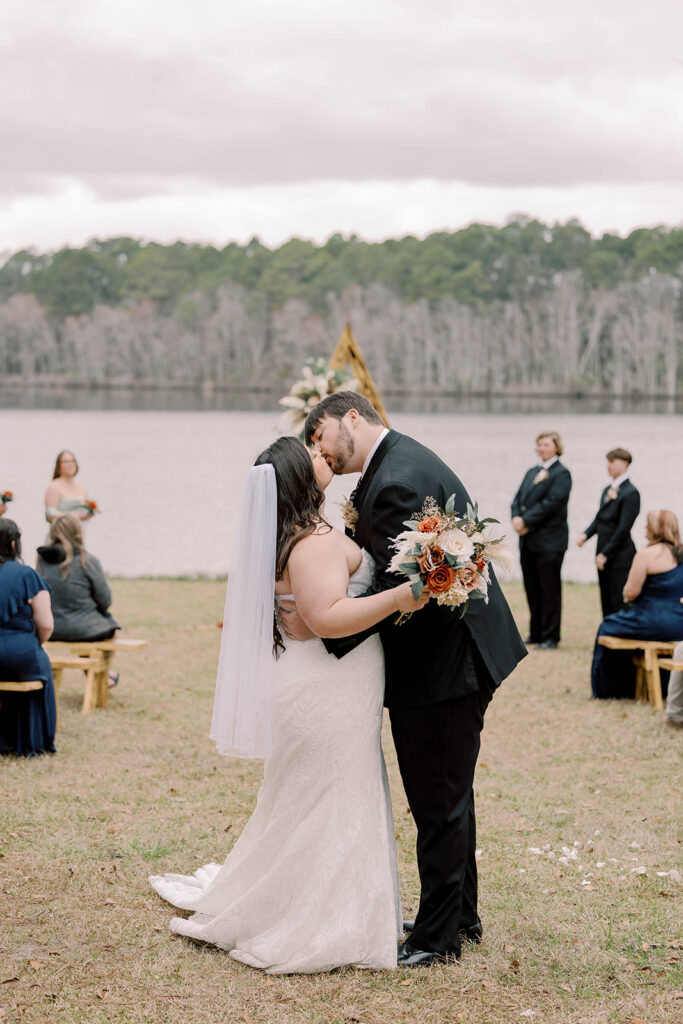portrait of the newly married couple kissing