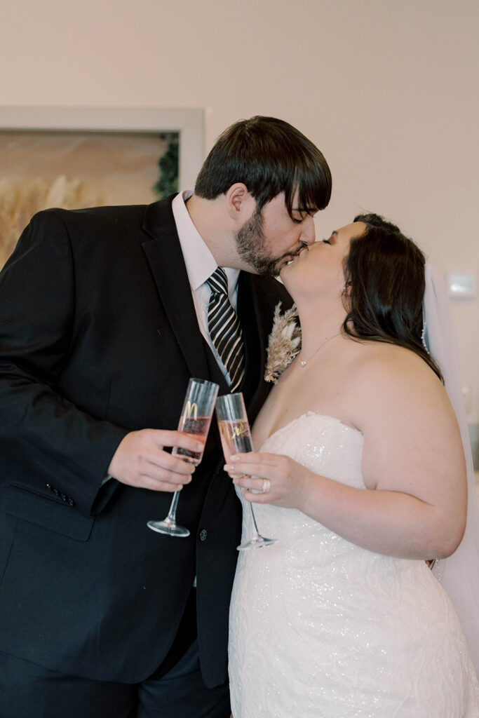 newly married couple celebrating with champagne