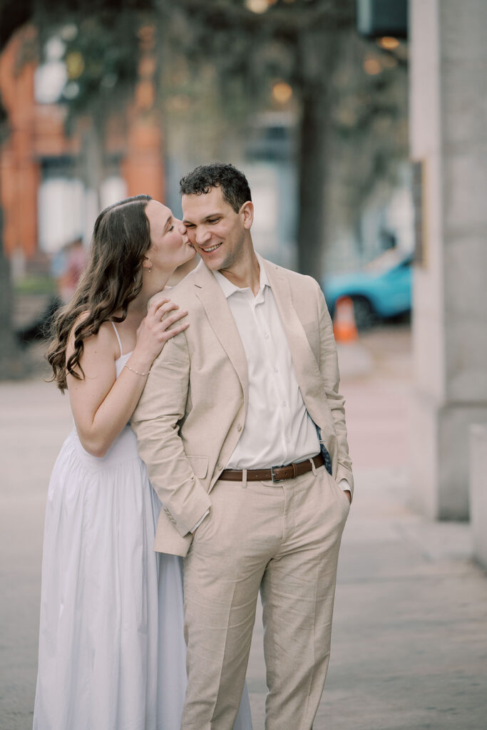 fiance kissing her fiance on the cheek