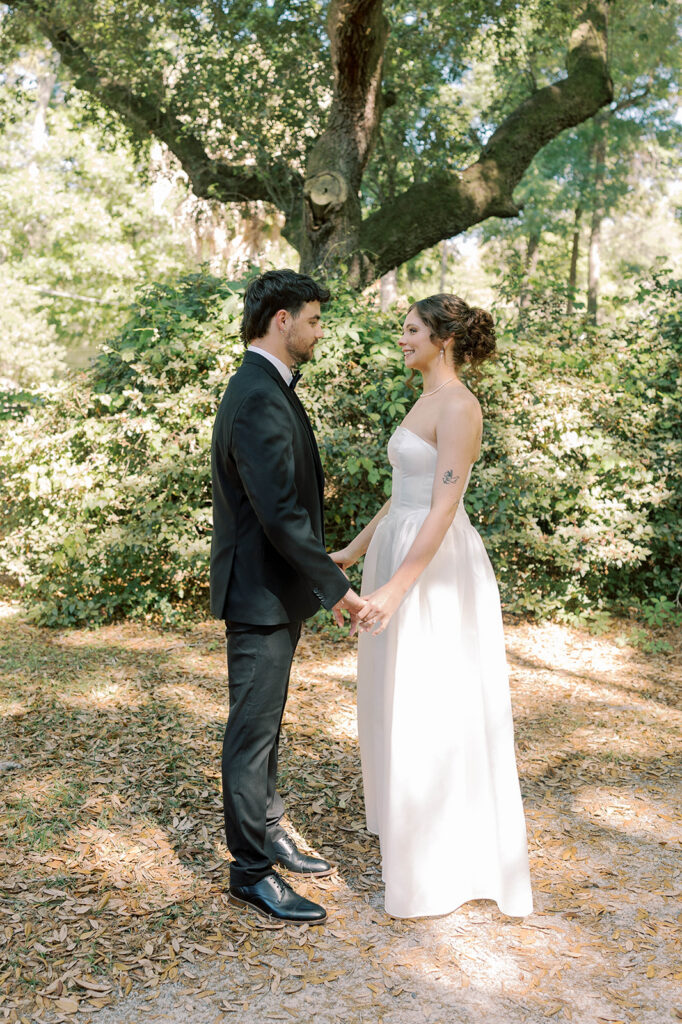 bride and groom holding hands during their first look