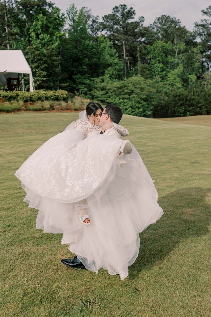 cute portrait of the newlyweds kissing
