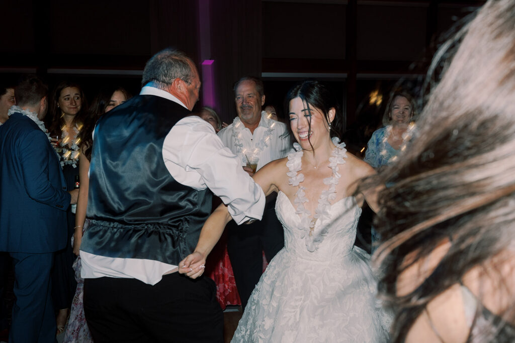 bride having the best time at her wedding reception party