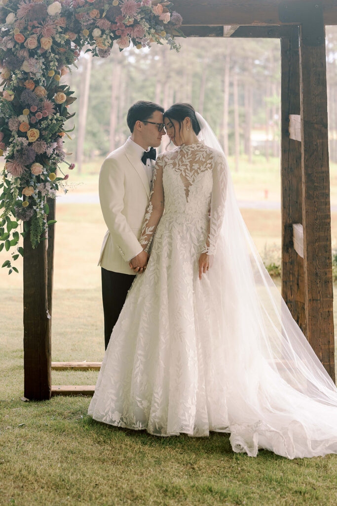 cute picture of the bride and groom holding hands