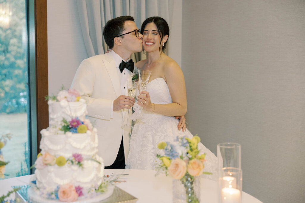 groom kissing the bride on the cheek