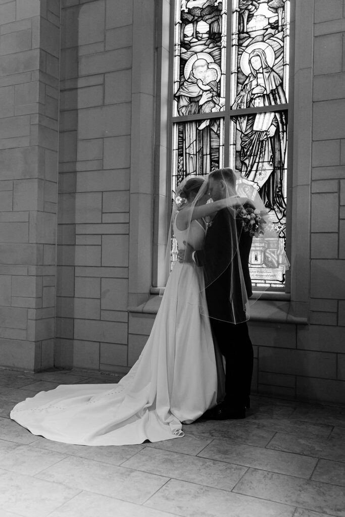 cute picture of the bride and groom kissing