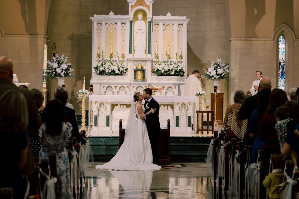 bride and groom kissing after their ceremony
