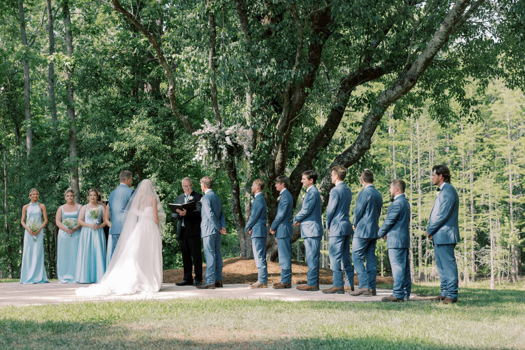 Bride and groom holding hands during their wedding ceremony