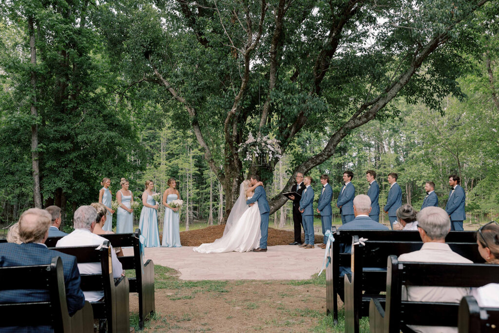 bride and groom kissing after their ceremony