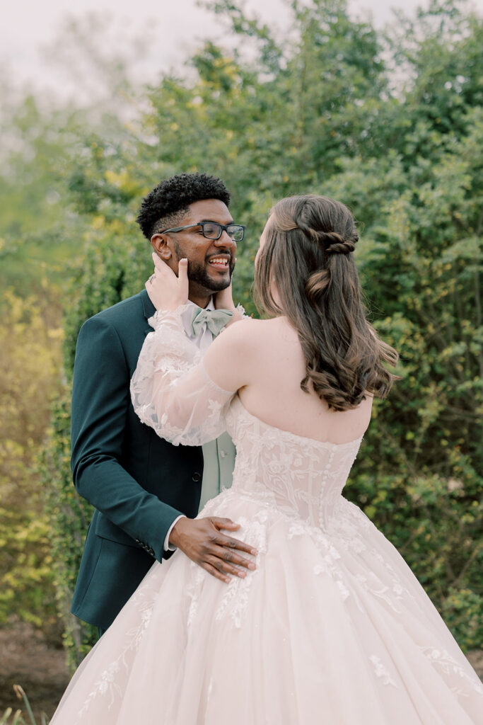 cute picture of the bride and groom hugging during their first look