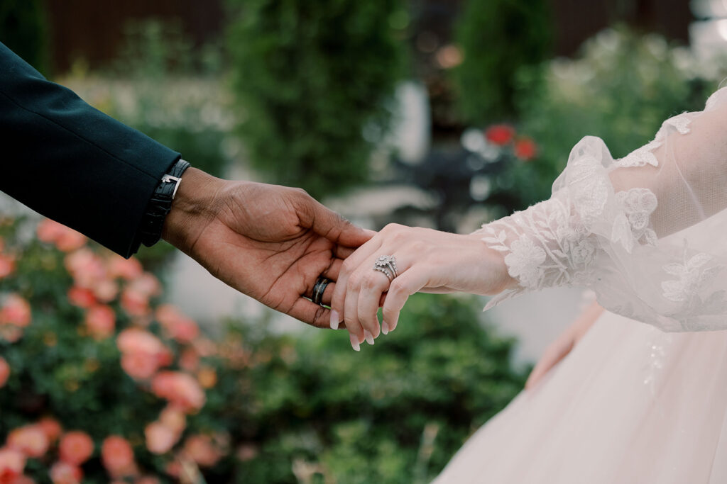 cute picture of the bride and groom holding hands