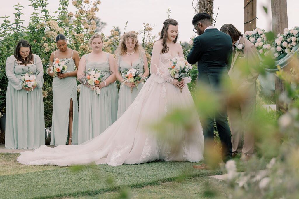 bride and groom holding hands during their ceremony