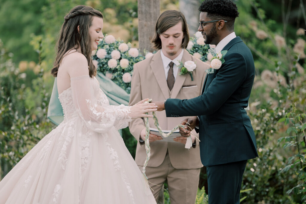 cute picture of the bride and groom holding hands