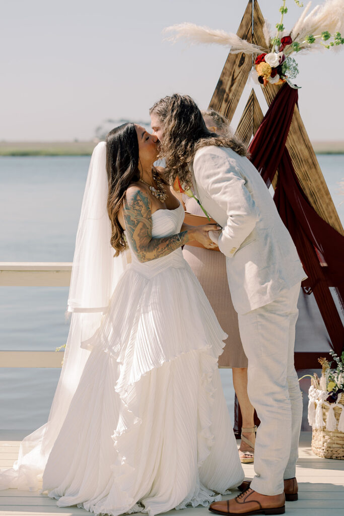 newlyweds kissing after their ceremony