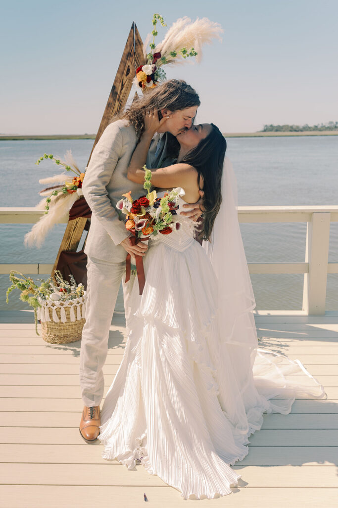 cute picture of the newlyweds kissing