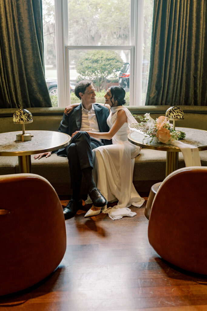 portrait of the bride and groom smiling at each other