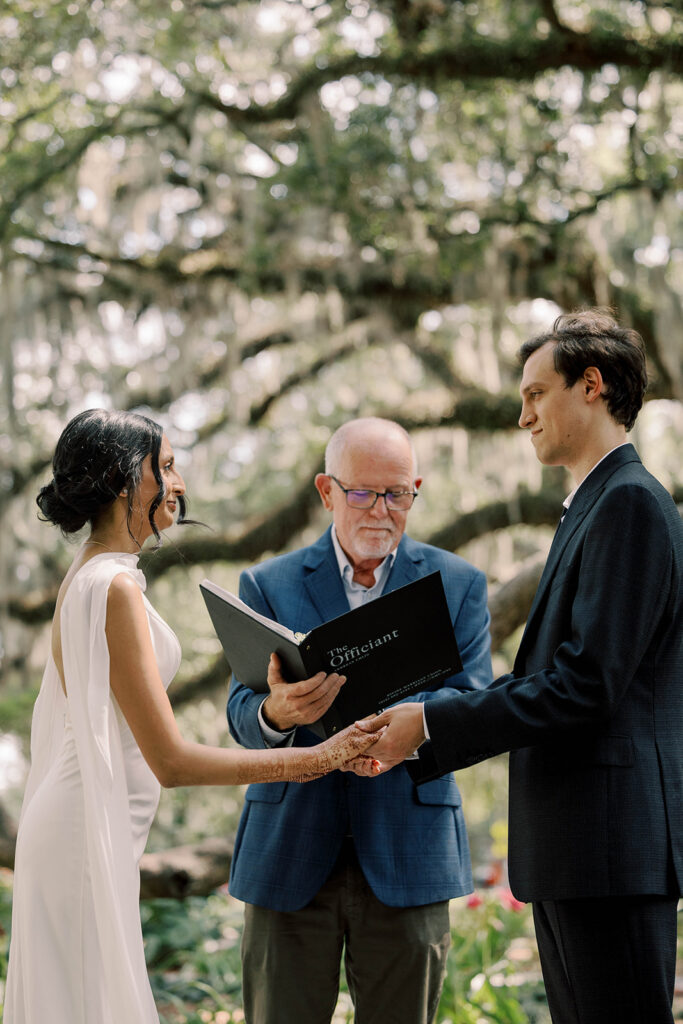 bride and groom holding hands during their elopement ceremony