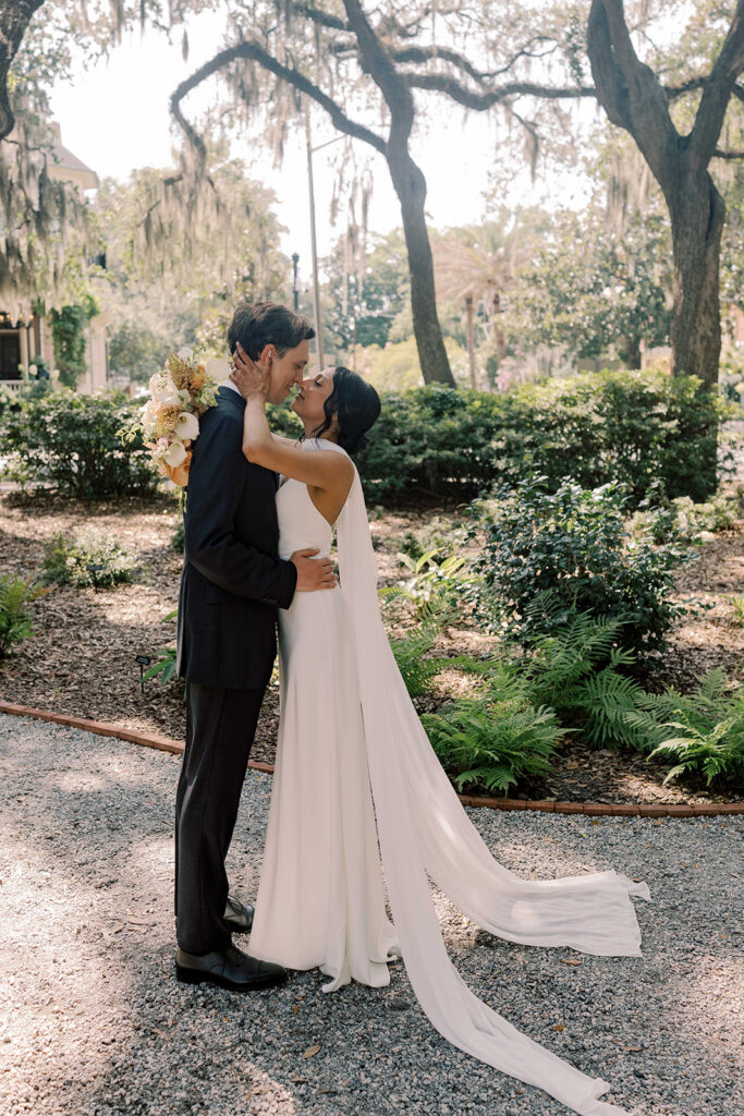 beautiful portrait of the newlyweds kissing