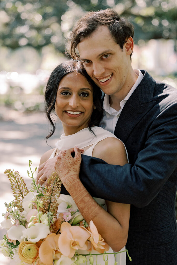 couple smiling at the camera during their photoshoot