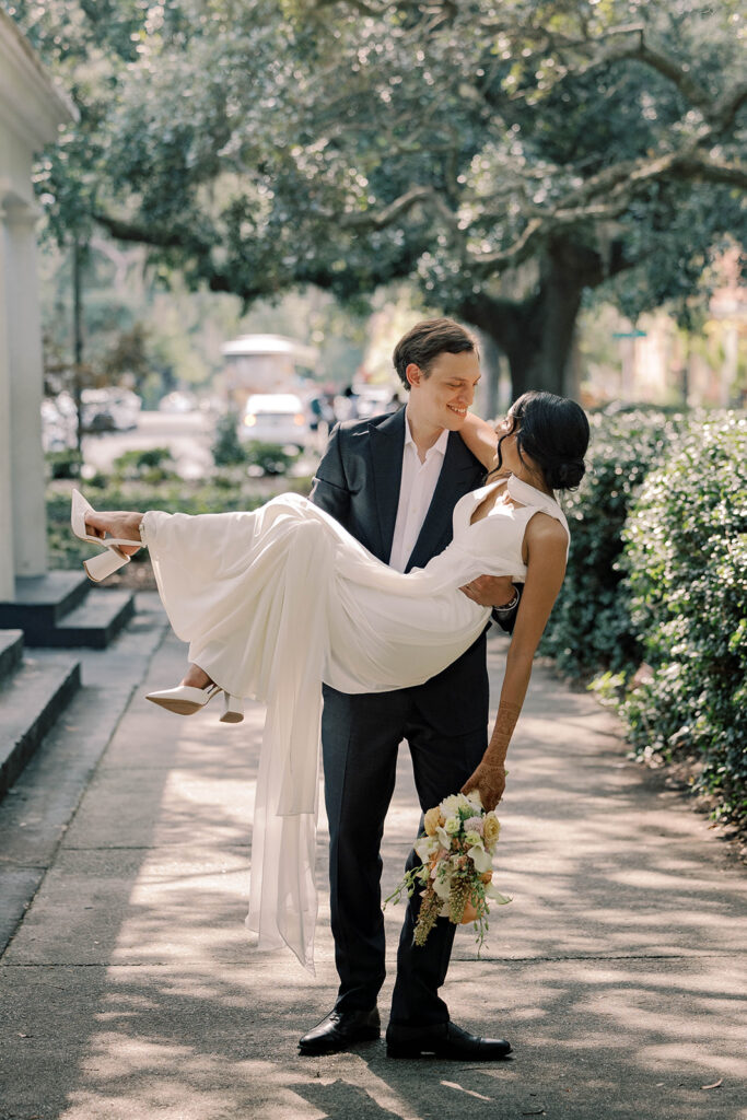 newlyweds smiling at each other during their photoshoot