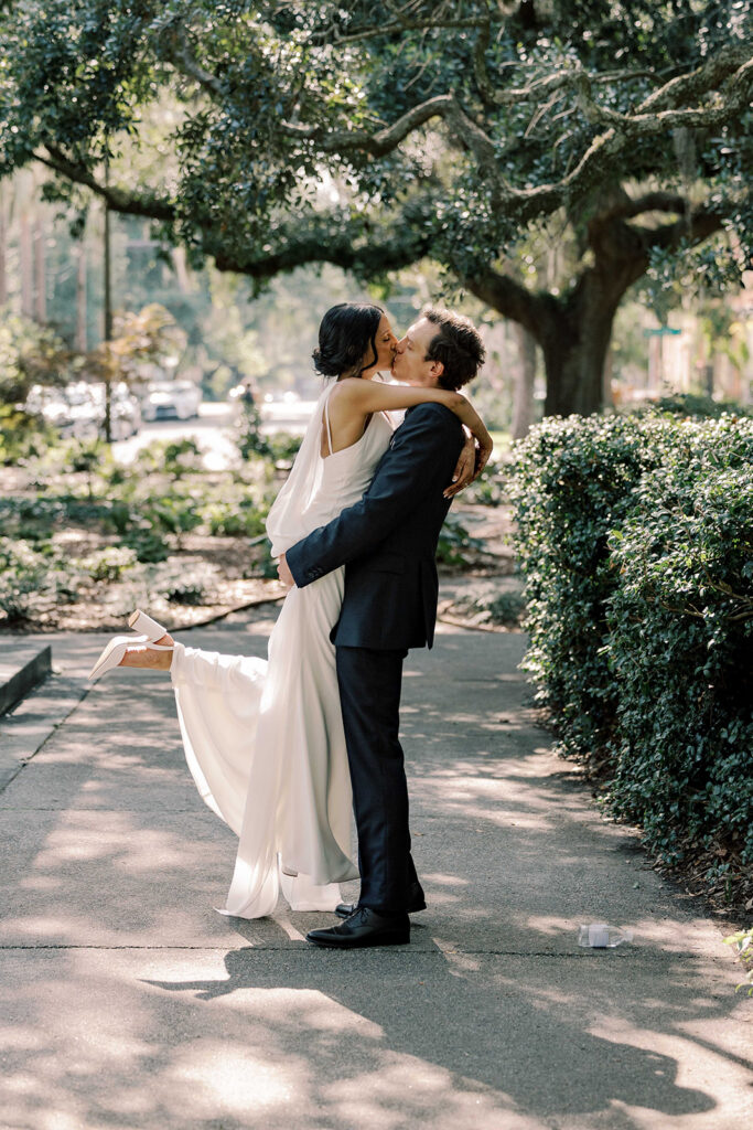 cute picture of the newlyweds kissing