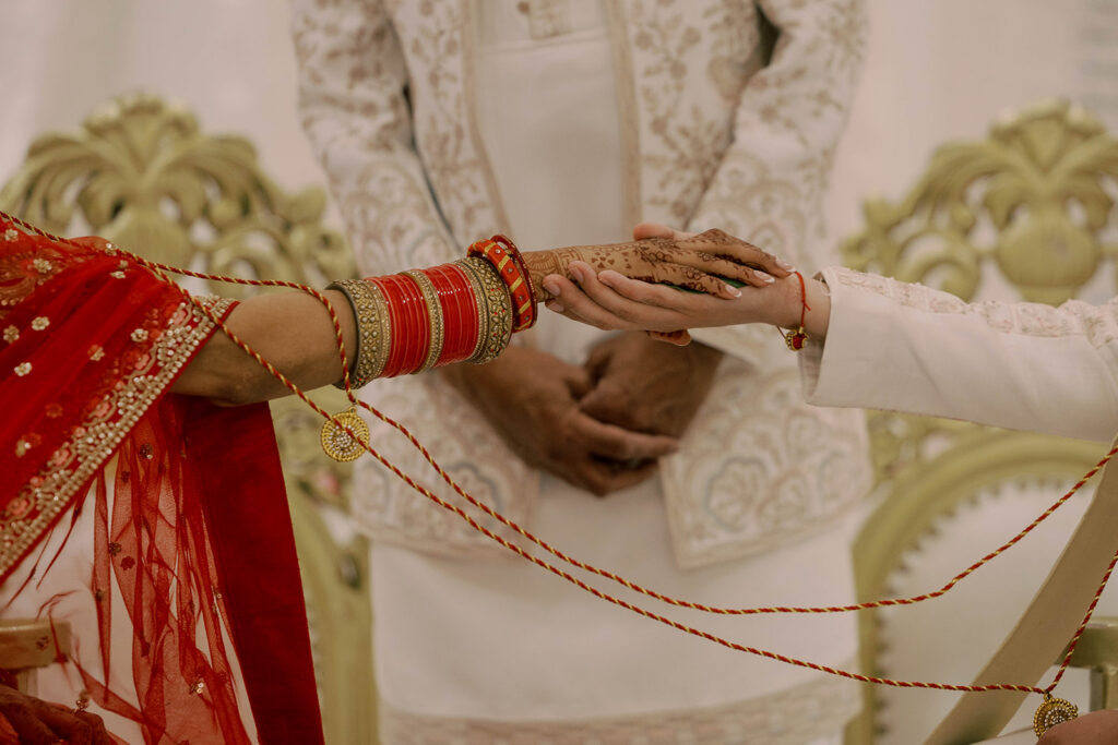 cute picture of the bride and groom holding hands