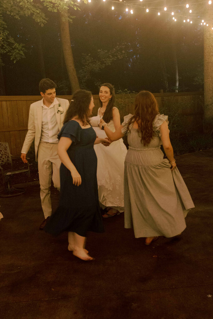 newlyweds having the best time at their wedding reception