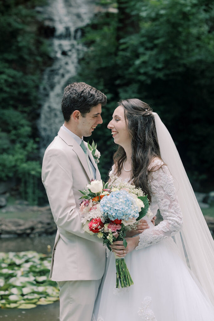 cute picture of the bride and groom smiling at each other