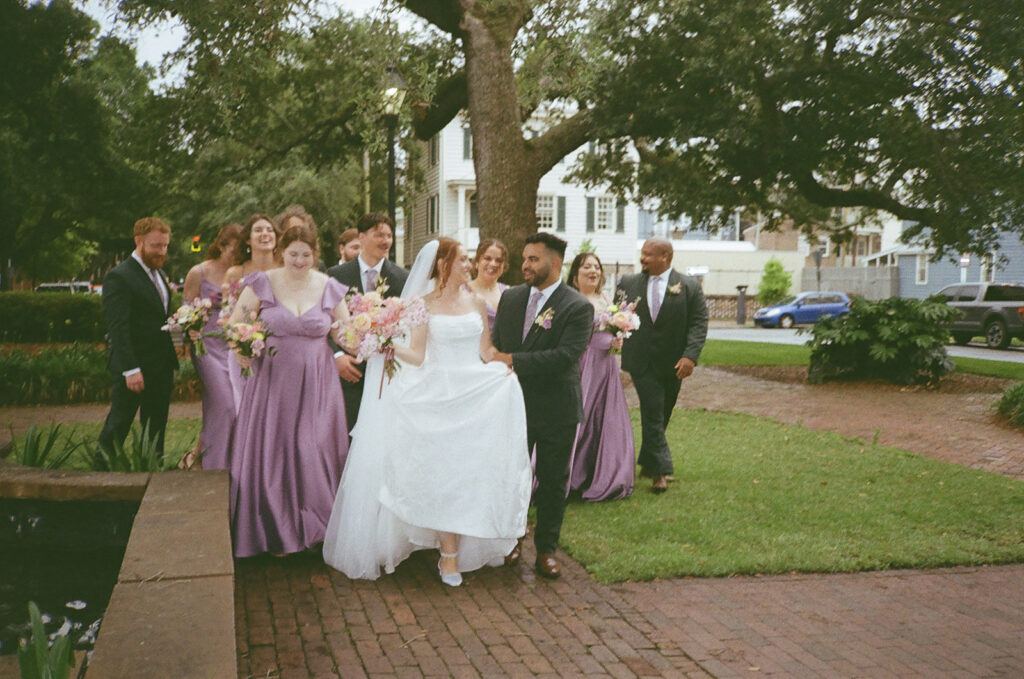 cute picture of the bride and groom with their bridal parties