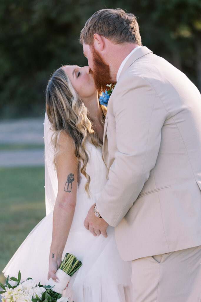 beautiful portrait of the bride and groom kissing