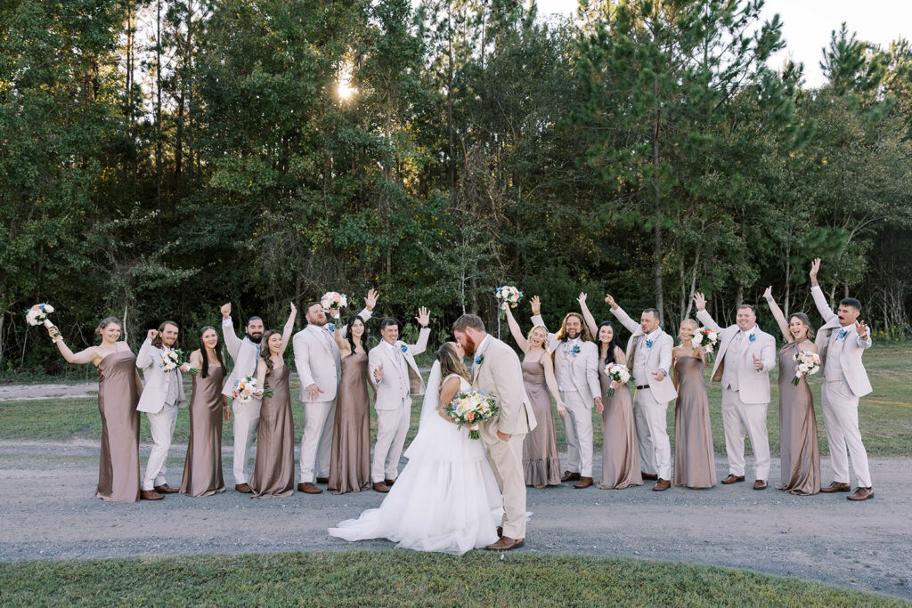 portrait of the newlyweds and their bridal parties