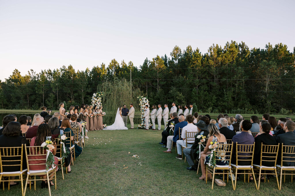 bride and groom holding hands during their wedding ceremony