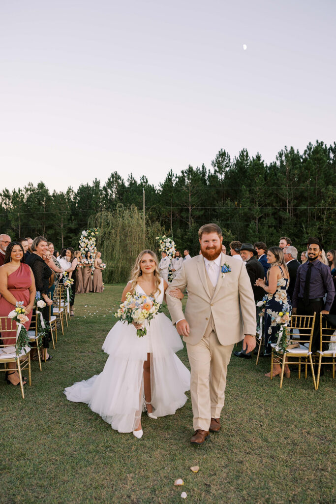newlyweds heading to their wedding reception
